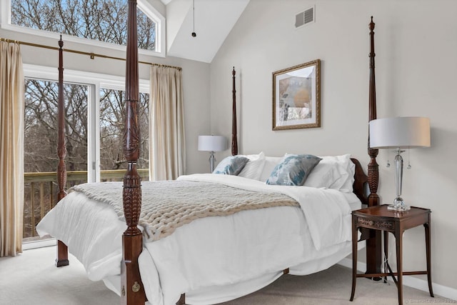 bedroom with light carpet, multiple windows, lofted ceiling, and visible vents