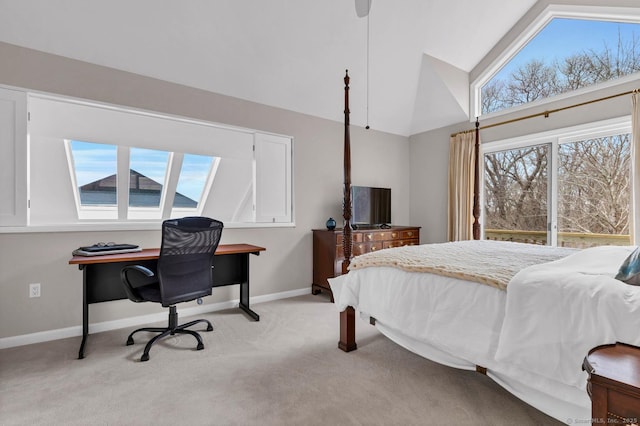 bedroom with lofted ceiling, light colored carpet, baseboards, and multiple windows