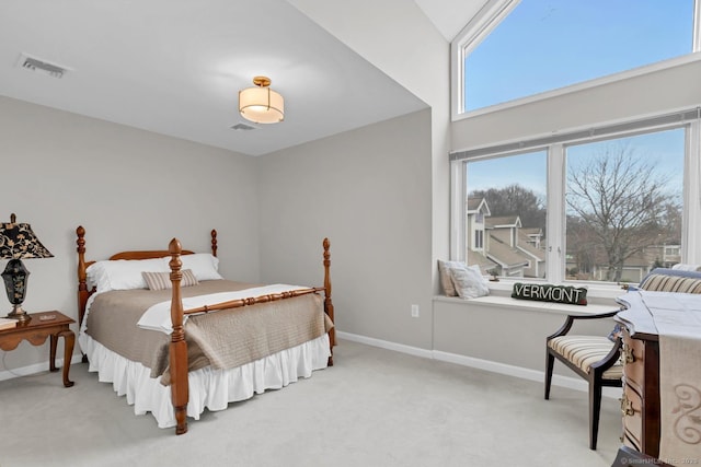 bedroom with light carpet, baseboards, and visible vents