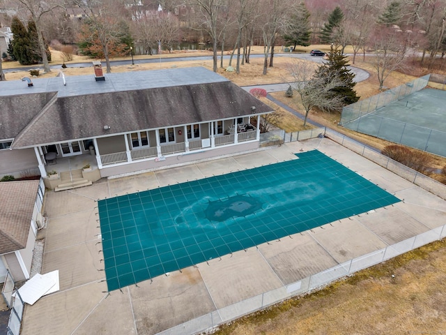 view of swimming pool featuring a fenced backyard, a fenced in pool, and a patio