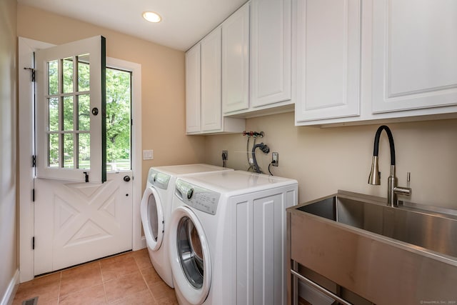 washroom featuring washing machine and dryer, recessed lighting, light tile patterned flooring, cabinet space, and a sink