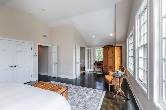 bedroom featuring visible vents, french doors, baseboards, dark wood-style flooring, and vaulted ceiling