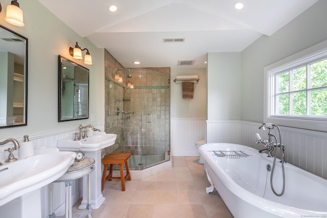 full bathroom with a soaking tub, visible vents, a stall shower, and wainscoting