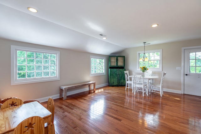 dining space with lofted ceiling, recessed lighting, baseboards, and wood-type flooring