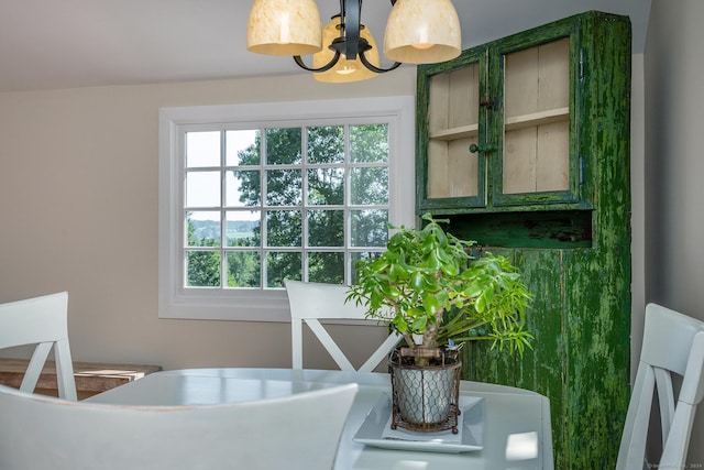 dining space featuring a notable chandelier