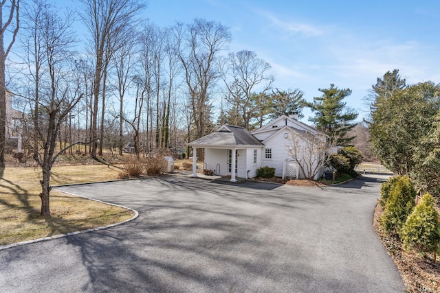 view of side of home with driveway