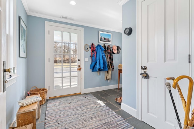 entryway with crown molding, plenty of natural light, baseboards, and visible vents