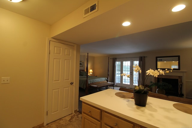 bathroom featuring recessed lighting, visible vents, and a fireplace