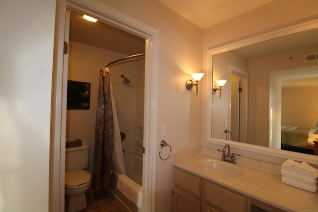 full bathroom featuring visible vents, vanity, toilet, and shower / tub combo with curtain