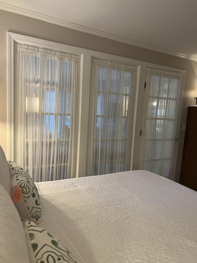 bedroom with ornamental molding