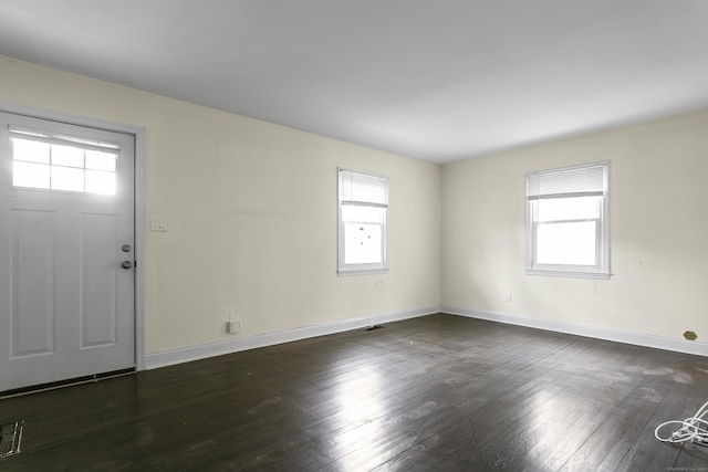 entrance foyer with hardwood / wood-style flooring and baseboards