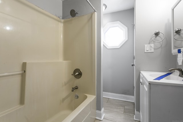 full bathroom featuring shower / bath combination, vanity, and baseboards