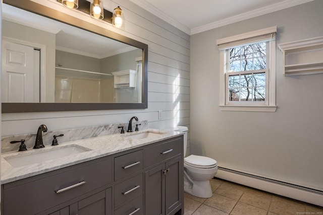 bathroom featuring a sink, a baseboard radiator, toilet, and crown molding