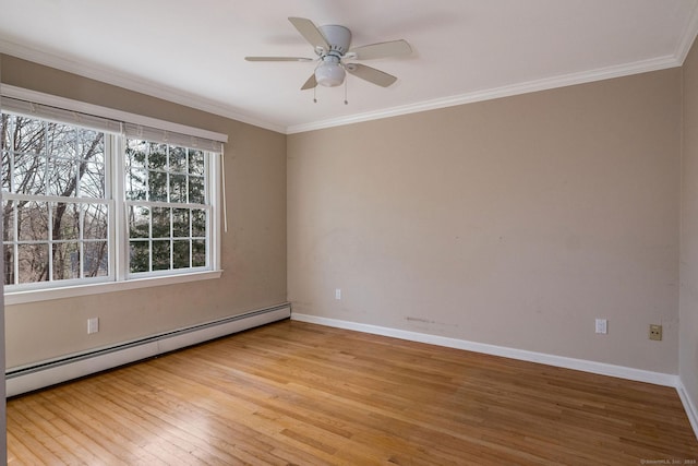 empty room featuring ornamental molding, baseboards, light wood finished floors, and a baseboard radiator