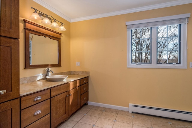 bathroom with vanity, baseboards, tile patterned flooring, a baseboard heating unit, and crown molding