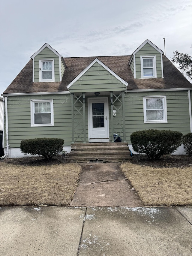 view of front of house with a shingled roof