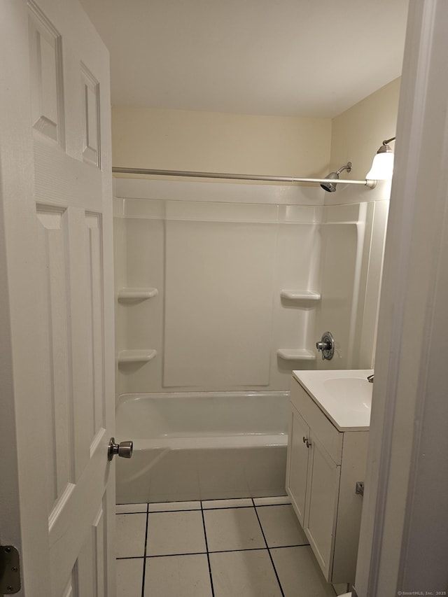 full bathroom with bathtub / shower combination, vanity, and tile patterned flooring