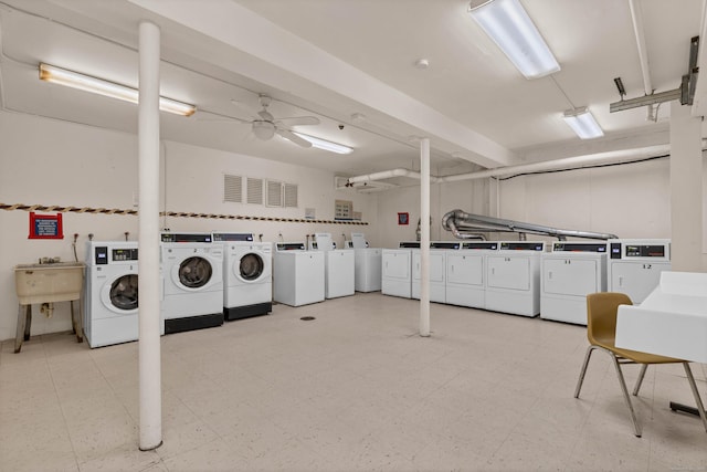 community laundry room featuring washer and dryer, a ceiling fan, tile patterned floors, and a sink