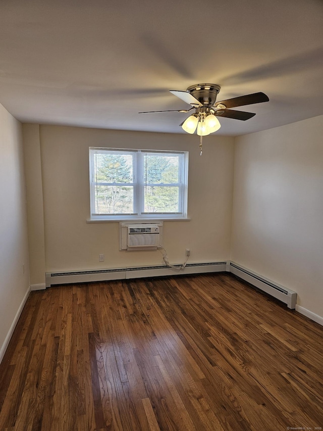 spare room featuring ceiling fan, baseboards, an AC wall unit, baseboard heating, and dark wood-style flooring