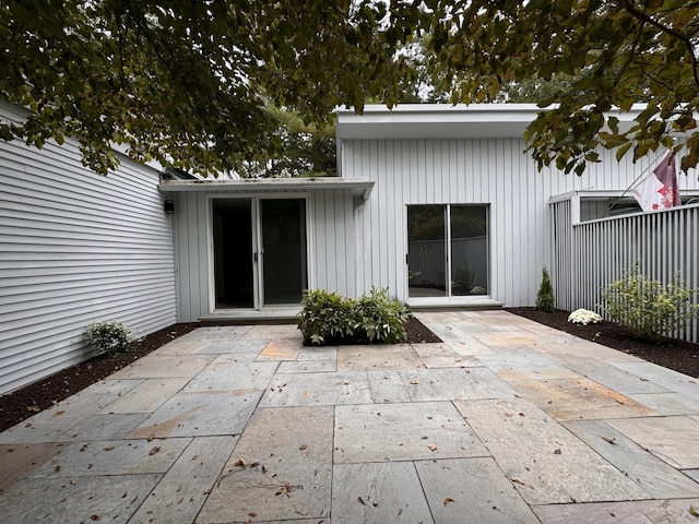 back of house with a patio area and fence