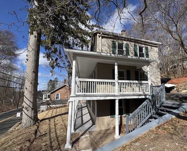 view of front of house with stairs