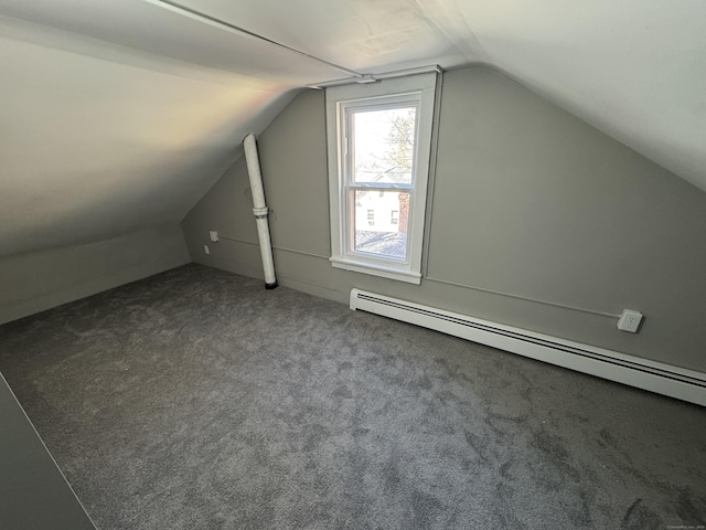 additional living space featuring vaulted ceiling, baseboard heating, and carpet flooring