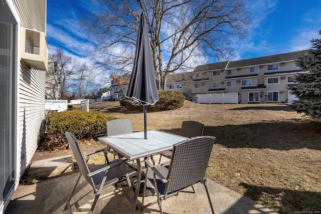 view of patio / terrace with a residential view and outdoor dining space