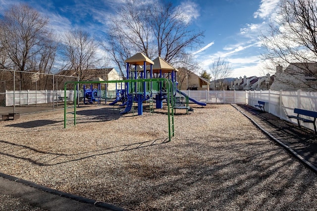 communal playground featuring fence