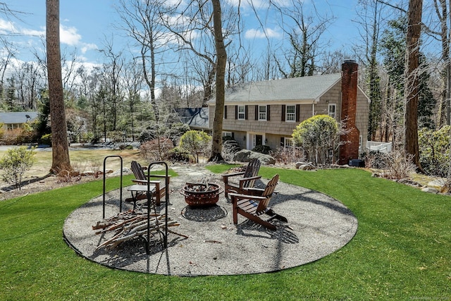 view of yard featuring a fire pit