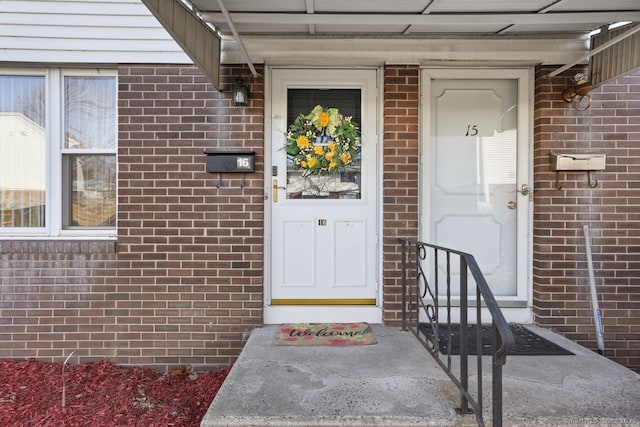 entrance to property with brick siding