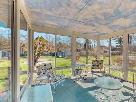 unfurnished sunroom with plenty of natural light