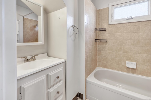 bathroom featuring vanity and bathing tub / shower combination