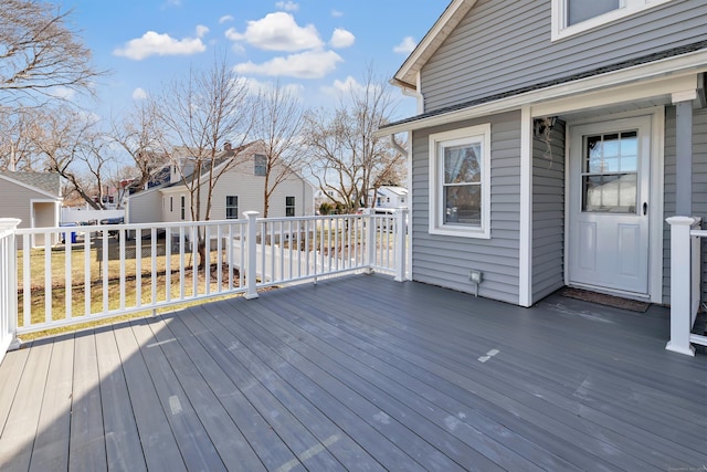 wooden terrace featuring a residential view