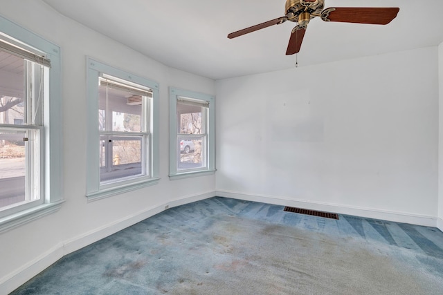 unfurnished room featuring visible vents, baseboards, and carpet