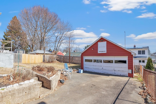 detached garage with fence