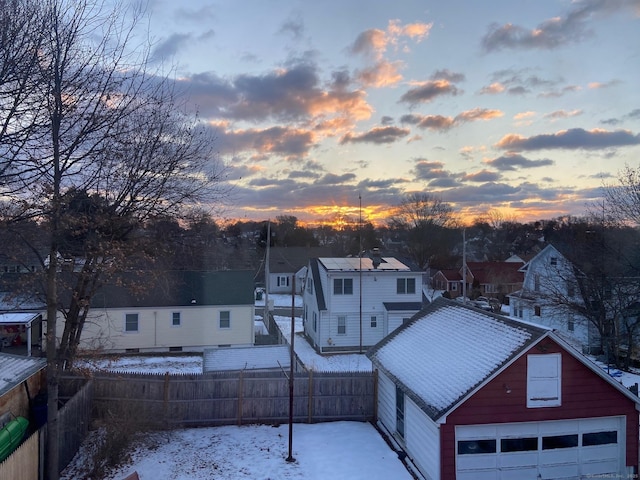 snowy aerial view with a residential view