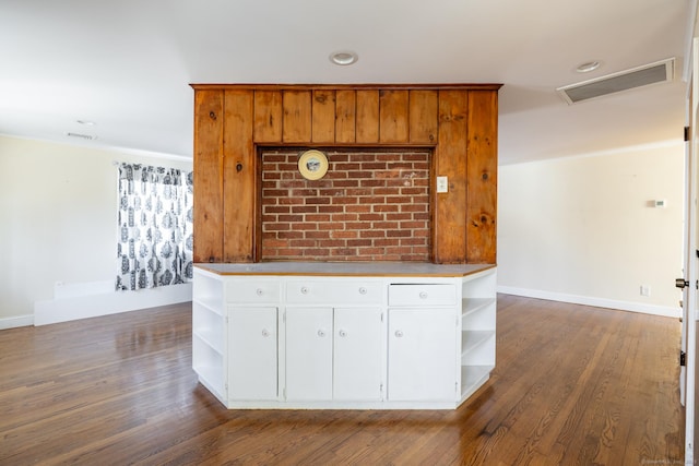 kitchen featuring dark wood finished floors, open shelves, and visible vents