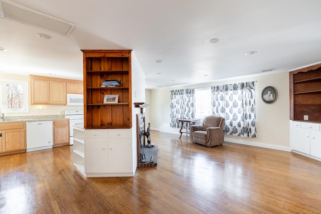 kitchen featuring open shelves, visible vents, white appliances, and a wealth of natural light