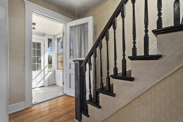 entrance foyer with stairway and wood finished floors