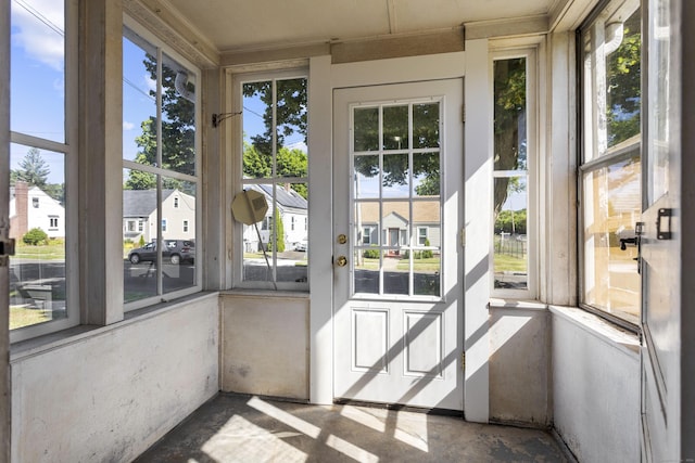 unfurnished sunroom featuring a residential view