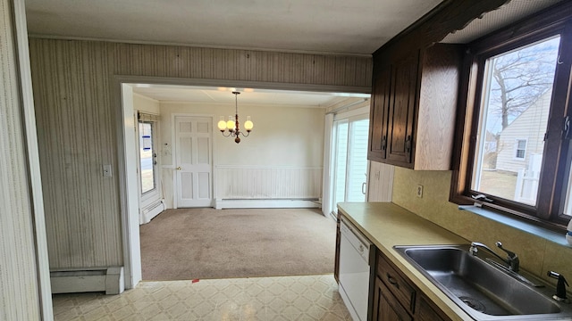 kitchen featuring a baseboard heating unit, light carpet, baseboard heating, white dishwasher, and a sink