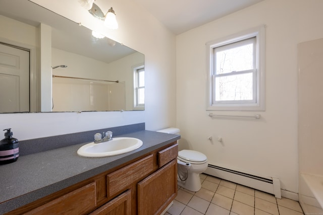 bathroom with tile patterned floors, baseboard heating, toilet, and vanity