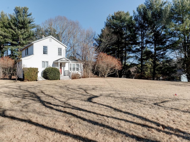 view of side of home featuring a chimney