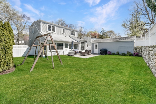 back of property featuring a patio, a lawn, a fenced backyard, and outdoor lounge area