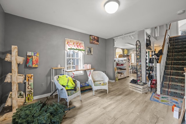 interior space featuring wood finished floors and baseboards