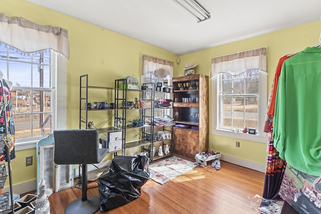 office space featuring baseboards and hardwood / wood-style flooring