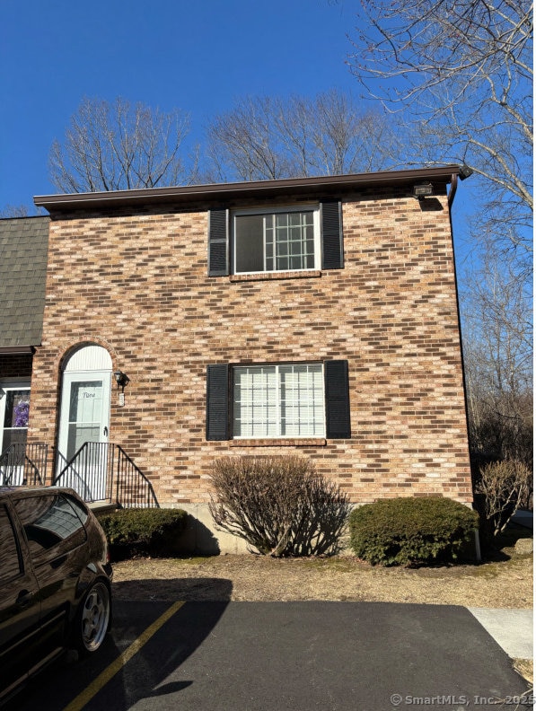 view of property exterior with brick siding