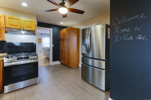 kitchen featuring backsplash, baseboards, under cabinet range hood, light wood-type flooring, and stainless steel appliances