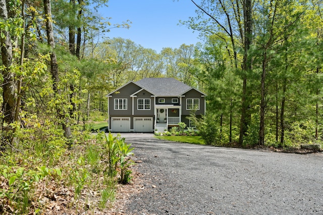 bi-level home featuring driveway and an attached garage