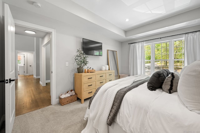 bedroom with recessed lighting, baseboards, and light colored carpet